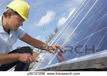 Man installing solar panels View Large Photo Image Stock Photo - Man installing solar panels. Fotosearch