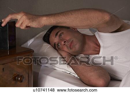 Man unable to sleep View Large Photo Image Stock Photo - Man unable to sleep. Fotosearch
