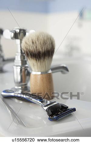 Stock Image - Man's shaving kit in bathroom. Fotosearch