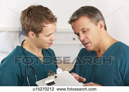 Stock Image - Medical staff working on hospital ward. Fotosearch