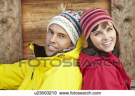 Stock Image - Middle Aged Couple Dressed For Cold Weather. Fotosearch