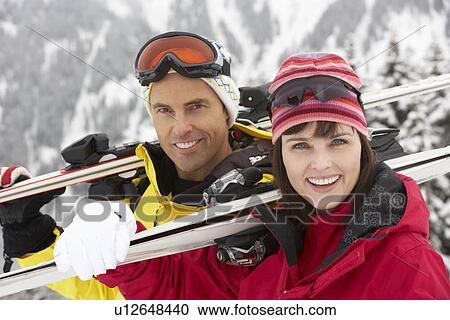 Middle Aged Couple On Ski Holiday In Mountains View Large Photo Image Stock Image - Middle Aged Couple On Ski Holiday In Mountains. Fotosearch