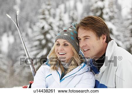 Middle Aged Couple On Ski Holiday In Mountains View Large Photo Image Stock Image - Middle Aged Couple On Ski Holiday In Mountains. Fotosearch