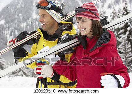 Middle Aged Couple On Ski Holiday In Mountains View Large Photo Image Stock Image - Middle Aged Couple On Ski Holiday In Mountains. Fotosearch