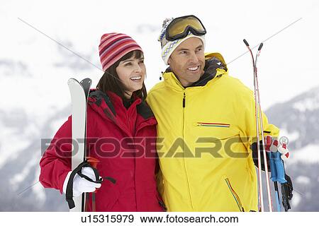 Middle Aged Couple On Ski Holiday In Mountains View Large Photo Image Stock Photo - Middle Aged Couple On Ski Holiday In Mountains. Fotosearch
