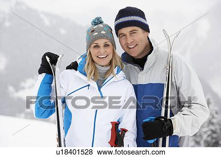 Middle Aged Couple On Ski Holiday In Mountains View Large Photo Image Stock Photo - Middle Aged Couple On Ski Holiday In Mountains. Fotosearch