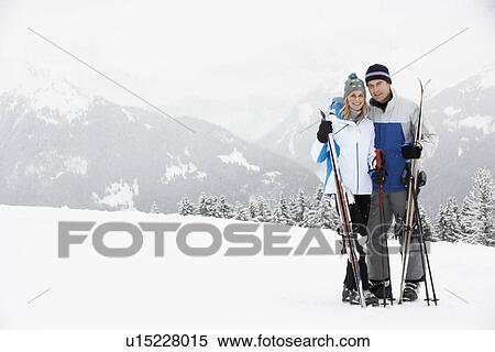 Middle Aged Couple On Ski Holiday In Mountains View Large Photo Image Stock Photography - Middle Aged Couple On Ski Holiday In Mountains. Fotosearch