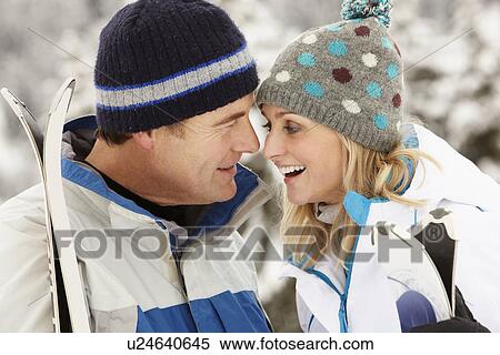 Middle Aged Couple On Ski Holiday In Mountains View Large Photo Image Stock Photography - Middle Aged Couple On Ski Holiday In Mountains. Fotosearch