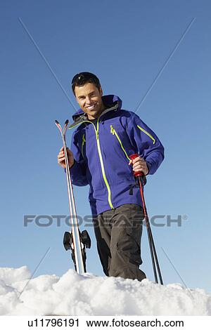 Middle Aged Man On Ski Holiday In Mountains View Large Photo Image Stock Image - Middle Aged Man On Ski Holiday In Mountains. Fotosearch