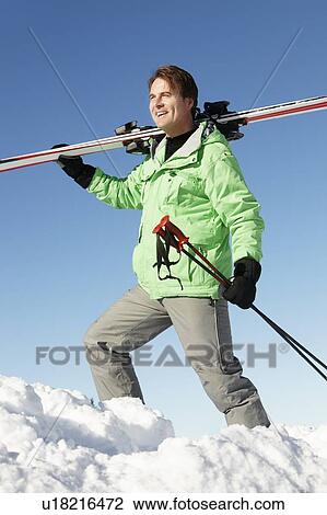 Middle Aged Man On Ski Holiday In Mountains View Large Photo Image Stock Image - Middle Aged Man On Ski Holiday In Mountains. Fotosearch