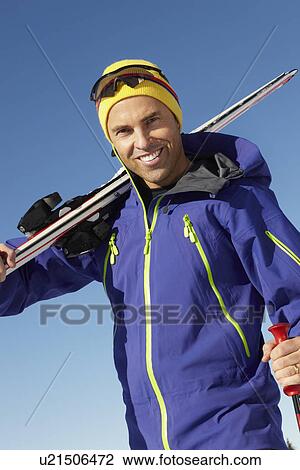 Middle Aged Man On Ski Holiday In Mountains View Large Photo Image Stock Image - Middle Aged Man On Ski Holiday In Mountains. Fotosearch