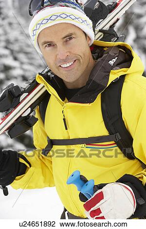 Middle Aged Man On Ski Holiday In Mountains View Large Photo Image Stock Image - Middle Aged Man On Ski Holiday In Mountains. Fotosearch