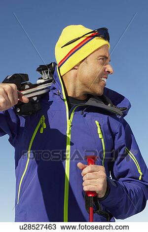 Middle Aged Man On Ski Holiday In Mountains View Large Photo Image Stock Image - Middle Aged Man On Ski Holiday In Mountains. Fotosearch