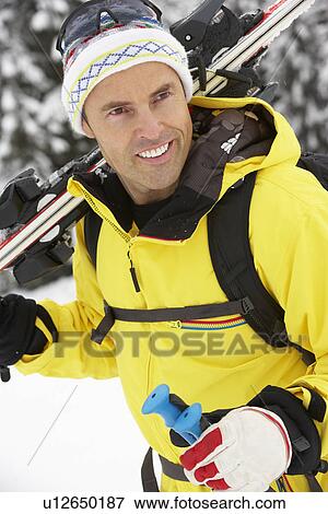Middle Aged Man On Ski Holiday In Mountains View Large Photo Image Stock Photo - Middle Aged Man On Ski Holiday In Mountains. Fotosearch