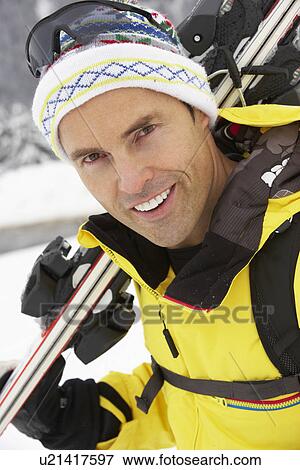 Middle Aged Man On Ski Holiday In Mountains View Large Photo Image Stock Photo - Middle Aged Man On Ski Holiday In Mountains. Fotosearch