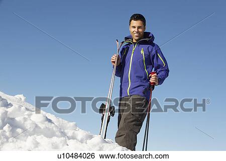 Middle Aged Man On Ski Holiday In Mountains View Large Photo Image Stock Photograph - Middle Aged Man On Ski Holiday In Mountains. Fotosearch