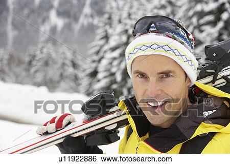 Middle Aged Man On Ski Holiday In Mountains View Large Photo Image Stock Photograph - Middle Aged Man On Ski Holiday In Mountains. Fotosearch