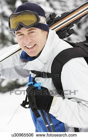 Middle Aged Man On Ski Holiday In Mountains View Large Photo Image Stock Photograph - Middle Aged Man On Ski Holiday In Mountains. Fotosearch