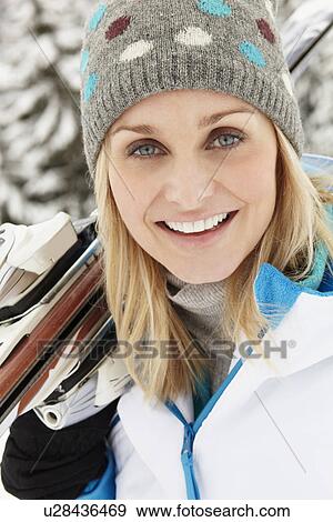 Middle Aged Woman On Ski Holiday In Mountains View Large Photo Image Stock Photo - Middle Aged Woman On Ski Holiday In Mountains. Fotosearch