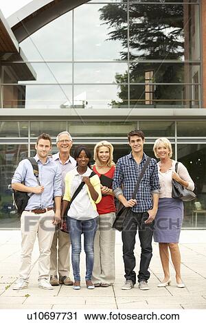 Stock Image - Mixed group of students outside college. Fotosearch
