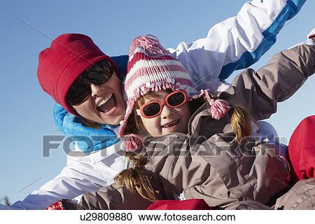 Mother And Daughter Having Fun On Ski Holiday In Mountains View Large Photo Image Stock Image - Mother And Daughter Having Fun On Ski Holiday In Mountains. Fotosearch