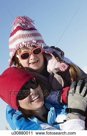 Mother And Daughter Having Fun On Ski Holiday In Mountains View Large Photo Image Stock Image - Mother And Daughter Having Fun On Ski Holiday In Mountains. Fotosearch