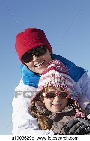 Mother And Daughter Having Fun On Ski Holiday In Mountains View Large Photo Image Stock Photography - Mother And Daughter Having Fun On Ski Holiday In Mountains. Fotosearch