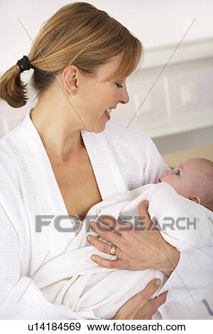 Mother in hospital with newborn baby View Large Photo Image Stock Photo - Mother in hospital with newborn baby. Fotosearch