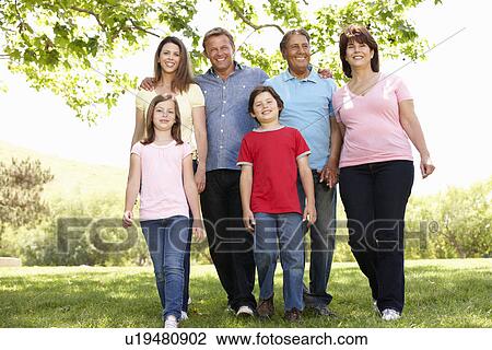 Stock Image - Multi generation Hispanic family in park. Fotosearch