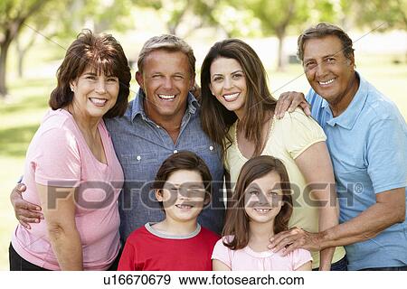 Stock Photo - Multi generation Hispanic family in park. Fotosearch