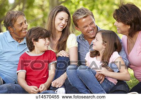 Stock Photography - Multi generation Hispanic family in park. Fotosearch