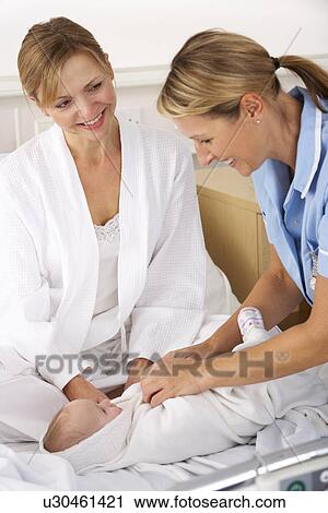 Nurse with mother and newborn baby View Large Photo Image Stock Image - Nurse with mother and newborn baby. Fotosearch