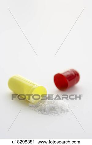 Stock Image - Opened medicinal capsule. Fotosearch