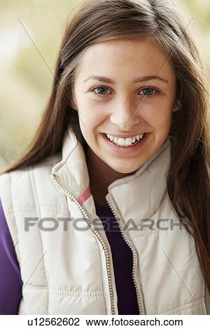 Stock Image - Outdoor Portrait Of Teenage Girl Wearing Winter Clothes. Fotosearch