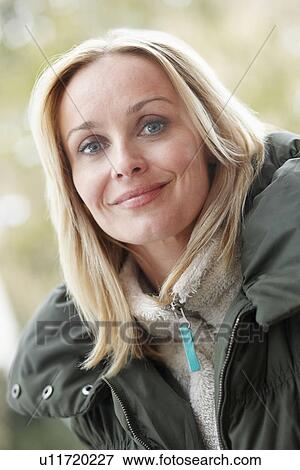 Stock Photo - Outdoor Portrait Of Woman Wearing Winter Clothes. Fotosearch