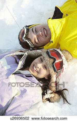 Overhead View Of Two Teenagers On Ski Holiday In Mountains View Large Photo Image Stock Image - Overhead View Of Two Teenagers On Ski Holiday In Mountains. Fotosearch