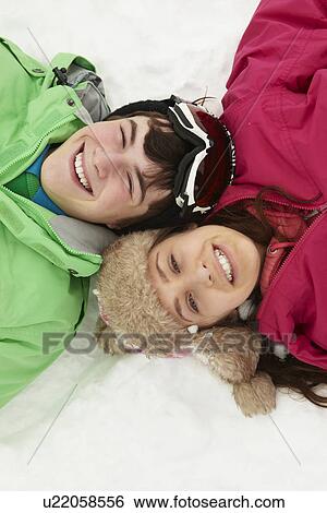 Overhead View Of Two Teenagers On Ski Holiday In Mountains View Large Photo Image Stock Photograph - Overhead View Of Two Teenagers On Ski Holiday In Mountains. Fotosearch