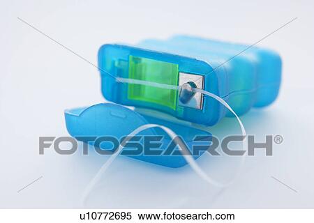 Stock Photography - Pack of dental floss. Fotosearch