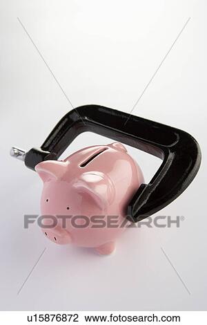 Stock Image - Piggybank in a vice. Fotosearch