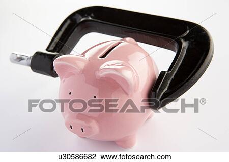 Piggybank in a vice View Large Photo Image Stock Image - Piggybank in a vice. Fotosearch