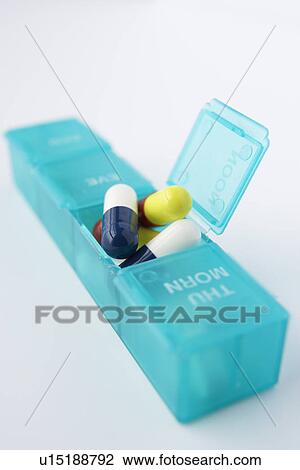 Stock Image - Pills in organiser. Fotosearch