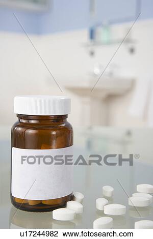 Stock Image - Pills on bathroom shelf. Fotosearch