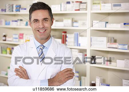 Stock Photograph - Portrait American pharmacist at work. Fotosearch