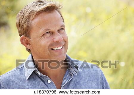 Stock Photograph - Portrait caucasian man outdoors. Fotosearch