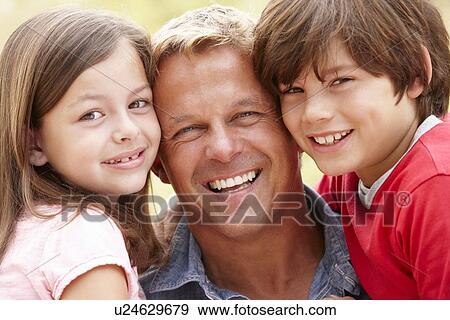 Portrait father and children outdoors View Large Photo Image Stock Photo - Portrait father and children outdoors. Fotosearch