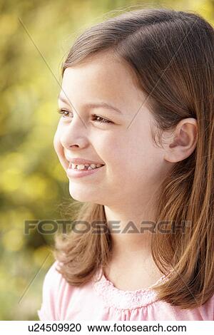 Stock Image - Portrait Hispanic girl outdoors. Fotosearch