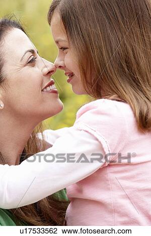 Stock Image - Portrait Hispanic mother and daughter. Fotosearch