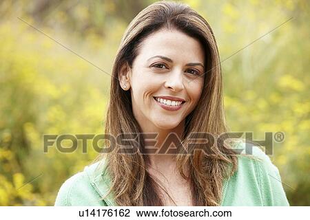 Stock Image - Portrait hispanic woman outdoors. Fotosearch