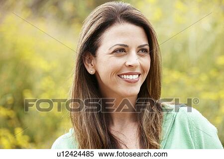Stock Photography - Portrait hispanic woman outdoors. Fotosearch