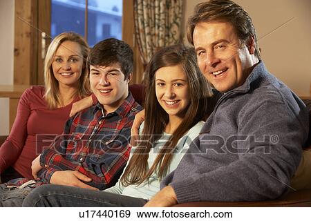 Portrait Of Family Relaxing On Sofa Together View Large Photo Image Stock Photo - Portrait Of Family Relaxing On Sofa Together. Fotosearch